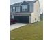 Charming two-story home with attached garage and well-manicured lawn at 512 Crow Field St, Roxboro, NC 27574