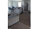 Open-concept living space with kitchen island, dining area, and modern appliances at 512 Crow Field St, Roxboro, NC 27574