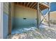 Exterior view of a home's foundation showing gravel and support beams, offering a glimpse into the property's structure at 512 Mill Hopper Ln, Apex, NC 27502