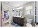 Well-lit bathroom with double vanity, decorative mirrors, and neutral tones, providing a clean and modern aesthetic at 512 Mill Hopper Ln, Apex, NC 27502
