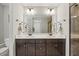 Bathroom featuring a double vanity, framed mirror, granite countertop, and tiled glass door shower at 512 Mill Hopper Ln, Apex, NC 27502