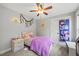 Bright bedroom featuring a cozy bed, soft carpet, and ample natural light, creating a peaceful and inviting atmosphere at 512 Mill Hopper Ln, Apex, NC 27502