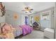 Charming bedroom with a whimsical touch, featuring a colorful bedspread and a delightful collection of toys at 512 Mill Hopper Ln, Apex, NC 27502