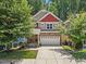 Charming two-story home with stone accents and well-manicured landscaping at 512 Mill Hopper Ln, Apex, NC 27502