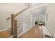 Elegant foyer featuring a staircase with wood railings and hardwood floors at 512 Mill Hopper Ln, Apex, NC 27502
