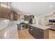 Well-equipped kitchen featuring a center island, stainless steel appliances, and sleek cabinetry at 512 Mill Hopper Ln, Apex, NC 27502