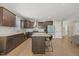 Modern kitchen with granite countertops, stainless steel appliances and island with seating at 512 Mill Hopper Ln, Apex, NC 27502
