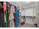 Organized walk-in closet with built-in shelving, hanging rods, and plenty of storage space at 512 Mill Hopper Ln, Apex, NC 27502