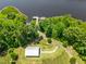 Aerial view of lake featuring a gazebo and scenic walking path along lake with chair-lined deck at 529 Lake Gaston Dr, Fuquay Varina, NC 27526
