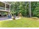 Fenced backyard with a patio, a lawn and a playset at 529 Lake Gaston Dr, Fuquay Varina, NC 27526