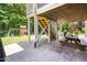 Backyard patio area featuring outdoor seating and a playset visible in the yard at 529 Lake Gaston Dr, Fuquay Varina, NC 27526