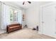 Neutral bedroom with a bench under the window and a door leading to another room at 529 Lake Gaston Dr, Fuquay Varina, NC 27526