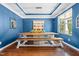 Bright dining room features a wooden table with bench seating, and tasteful decorations to make you feel at home at 529 Lake Gaston Dr, Fuquay Varina, NC 27526