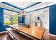 Bright dining area with large windows, natural light, stylish furnishings, and modern lighting at 529 Lake Gaston Dr, Fuquay Varina, NC 27526