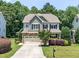 Charming two-story home with a stone-accented facade, inviting curb appeal, and attached two car garage at 529 Lake Gaston Dr, Fuquay Varina, NC 27526