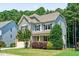 Charming two-story home with a stone-accented facade, inviting curb appeal, and attached two car garage at 529 Lake Gaston Dr, Fuquay Varina, NC 27526