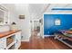 Hallway features hardwood floors, neutral paint, and leads into a dining area and Gathering room at 529 Lake Gaston Dr, Fuquay Varina, NC 27526