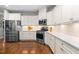 Modern kitchen features stainless steel appliances, white cabinets, and light countertops at 529 Lake Gaston Dr, Fuquay Varina, NC 27526