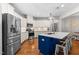 Updated kitchen features stainless steel appliances, white cabinets, and a center island with breakfast bar at 529 Lake Gaston Dr, Fuquay Varina, NC 27526