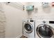 Laundry room with modern washer and dryer and storage options at 529 Lake Gaston Dr, Fuquay Varina, NC 27526