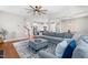 Open-concept living room and kitchen area features hardwood floors and plenty of space for entertaining at 529 Lake Gaston Dr, Fuquay Varina, NC 27526