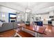 Open concept living space featuring living room, dining area, and kitchen, with hardwood floors throughout at 529 Lake Gaston Dr, Fuquay Varina, NC 27526