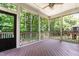Screened porch providing an outdoor view of the backyard and a ceiling fan at 529 Lake Gaston Dr, Fuquay Varina, NC 27526