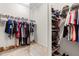 Organized walk-in closet featuring shelving on each side and hanging rods at 529 Lake Gaston Dr, Fuquay Varina, NC 27526