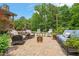 Backyard brick patio is ready for enjoying company outdoors at 53 Lake Wendell Rd, Wendell, NC 27591