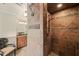 A tiled shower and view of vanity in a bathroom, showcasing neutral colors and stone accents at 53 Lake Wendell Rd, Wendell, NC 27591