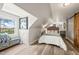 Cozy bedroom includes bench storage, transom window and calming colors at 53 Lake Wendell Rd, Wendell, NC 27591