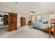 Large bedroom with a four poster bed and an attached office space visible through an open door at 53 Lake Wendell Rd, Wendell, NC 27591