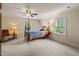 Comfortable bedroom featuring a four poster bed, sitting chair and bedside tables at 53 Lake Wendell Rd, Wendell, NC 27591