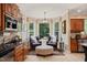 Cozy breakfast nook with bay windows offering scenic views and comfortable seating at 53 Lake Wendell Rd, Wendell, NC 27591