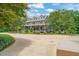 Charming two-story home with a spacious front yard and a long driveway leading up to the house at 53 Lake Wendell Rd, Wendell, NC 27591