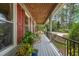 Charming front porch with rocking chairs, shutters and lighting at 53 Lake Wendell Rd, Wendell, NC 27591