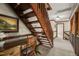 Hallway with stairs, a desk and chair, and views of the upstairs landing at 53 Lake Wendell Rd, Wendell, NC 27591