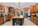 Spacious kitchen featuring custom wood cabinetry, granite countertops, and a central island at 53 Lake Wendell Rd, Wendell, NC 27591