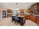 Spacious kitchen with a center island, stone accents, and modern appliances at 53 Lake Wendell Rd, Wendell, NC 27591