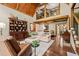 Cozy living room with vaulted ceilings, wooden beams, hardwood floors, and natural light at 53 Lake Wendell Rd, Wendell, NC 27591