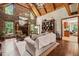 Bright and inviting living room with a stone fireplace, hardwood floors, and natural light at 53 Lake Wendell Rd, Wendell, NC 27591