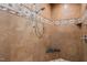 Modern shower featuring sleek tiles, a handheld shower head, and built-in corner shelves at 53 Lake Wendell Rd, Wendell, NC 27591