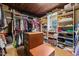 Walk-in closet with custom shelves and an island for storage and organization at 53 Lake Wendell Rd, Wendell, NC 27591