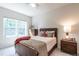 Cozy bedroom with natural light, queen bed, and matching nightstands and dressers at 6147 Beale Loop, Raleigh, NC 27616