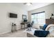 Bedroom with a desk, computer, and a comfortable sofa with a window view at 6147 Beale Loop, Raleigh, NC 27616
