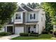 Charming townhome with attached garage, well-manicured lawn, and welcoming covered entrance at 6147 Beale Loop, Raleigh, NC 27616