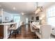 Open-concept living and dining area filled with natural light, featuring hardwood floors and modern finishes at 6147 Beale Loop, Raleigh, NC 27616