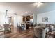 Open-concept living space featuring hardwood floors, modern kitchen, and a comfortable living area at 6147 Beale Loop, Raleigh, NC 27616