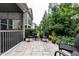 An outdoor patio, showcasing a seating area adjacent to the screened-in porch at 6147 Beale Loop, Raleigh, NC 27616