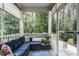Screened porch with comfortable seating and scenic views of the lush greenery at 6147 Beale Loop, Raleigh, NC 27616